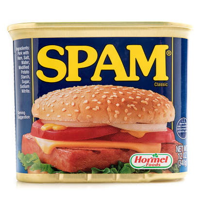 Miami, Florida, USA- June 1, 2015: A can of SPAM isolated on a white background. Spam stands for Spiced Pork and Ham, which is a canned precooked meat product. It is made by the Hormel Foods Corporation and was introduced in 1937.