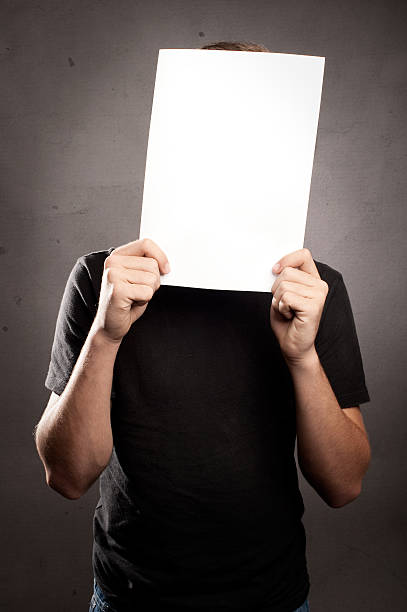 istock young man holding a blank picture 505997384
