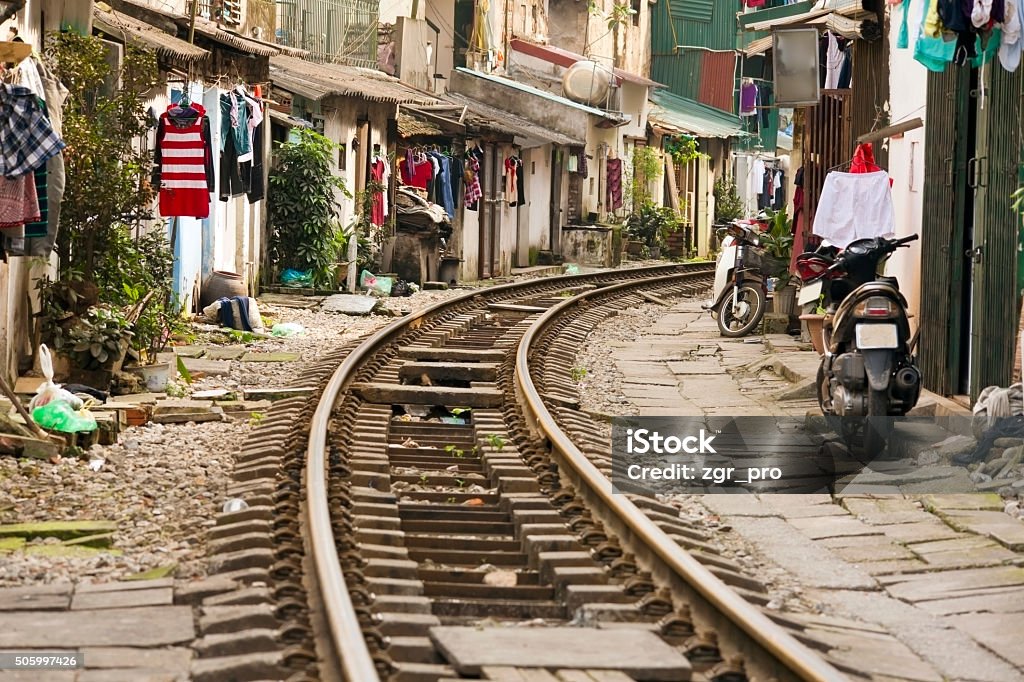 train passing through streets of hanoi slums, vietnam Hanoi Stock Photo