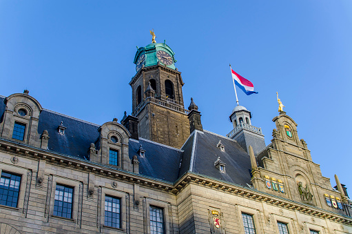 Detail of the Rotterdam city hall with the Dutch flag