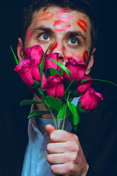 istock attractive guy with kisses on his face, Valentine's Day 506008778