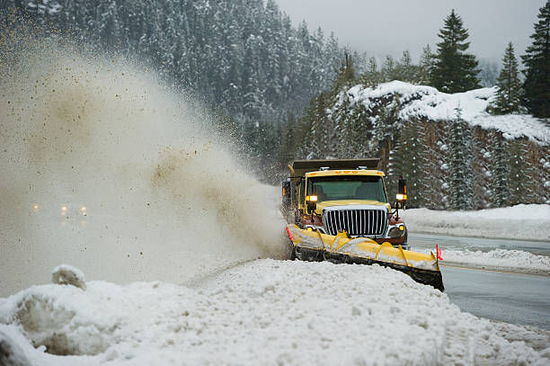 istock Snow plow clearing a slushy highway 506008924