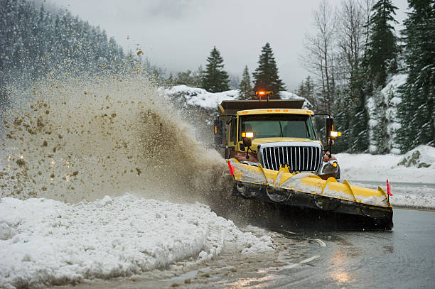 istock Snow plow clearing a slushy highway 506008978