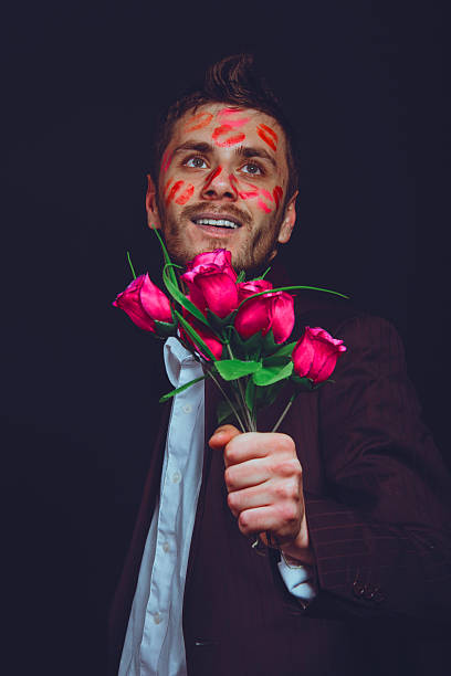 istock attractive guy with kisses on his face, Valentine's Day 506009018