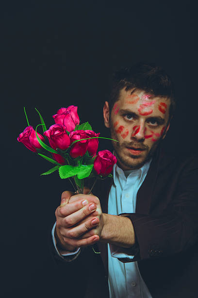 istock attractive guy with kisses on his face, Valentine's Day 506009160