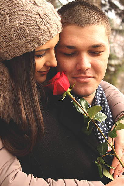 istock Close-up young couple with red rose 506009408