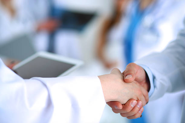 istock Young medical people handshaking at office 506009868