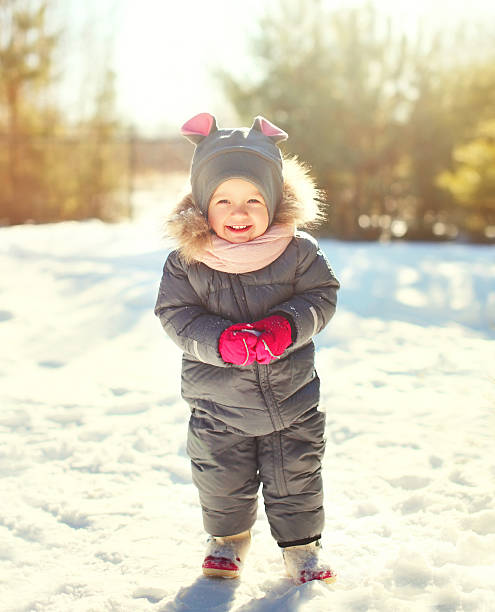 istock Cheerful smiling little child playing in sunny winter day 506010672