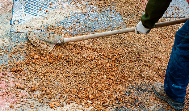 istock worker committed to the repair of a large pit road 506010748