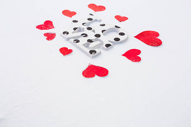 istock Red hearts and love on snow 506012236