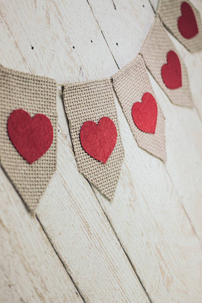 istock Valentine’s hearts on rustic wooden texture background 506013172