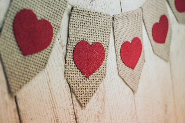 istock Valentine’s hearts on rustic wooden texture background 506013194