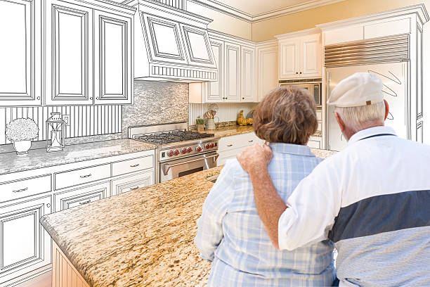 istock Senior Couple Looking Over Custom Kitchen Design Drawing and Photo 506014466