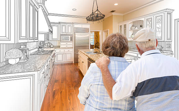 istock Senior Couple Looking Over Custom Kitchen Design Drawing and Photo 506014474