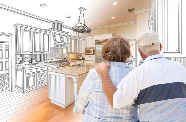 istock Senior Couple Looking Over Custom Kitchen Design Drawing 506014480