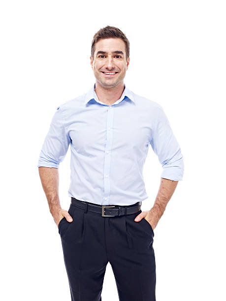 portrait of a caucasian businessman studio portrait of a caucasian corporate executive, hands in pockets, isolated on white background. expatriate photos stock pictures, royalty-free photos & images