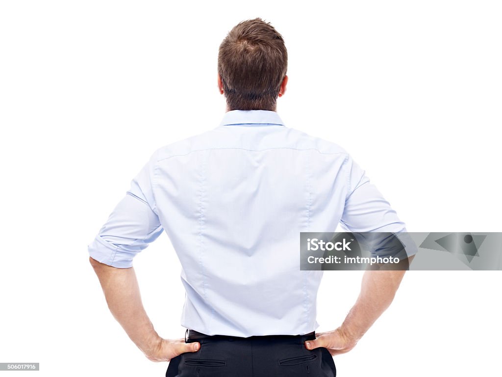 rear view of a caucasian businessman rear view of a caucasian corporate executive, isolated on white background. Rear View Stock Photo