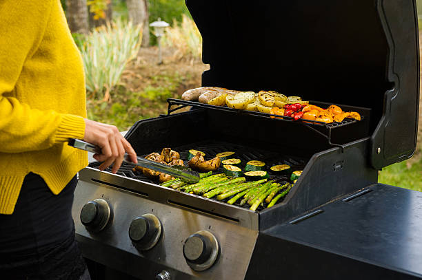 istock Woman cooking on the BBQ 506034042