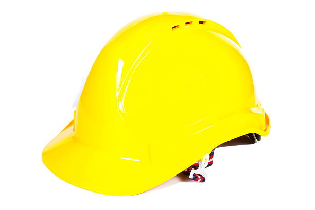 istock Closeup of yellow protective helmet on white background 506034490
