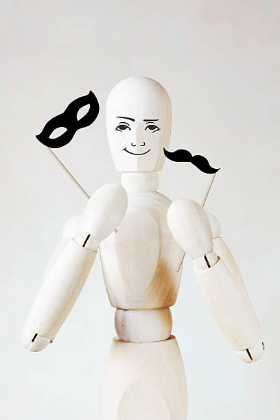 istock Man holds masquerade mask and fake mustache 506036370