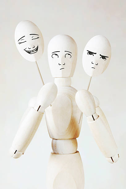 istock Man holds two masks with different mood 506036408