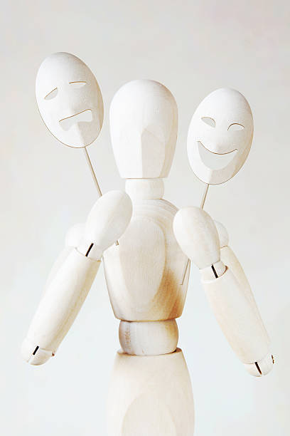 istock Man holds two theatrical masks with different tempers 506036452