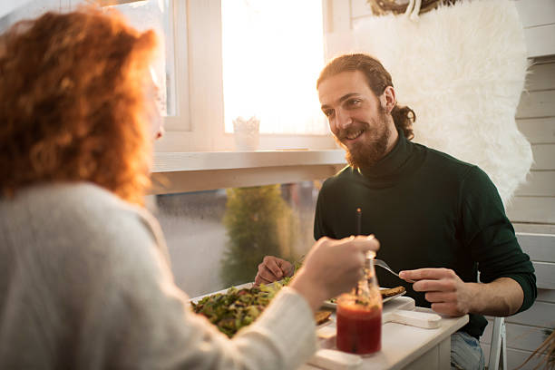 istock Happy man talking to his girlfriend during lunch. 506036614