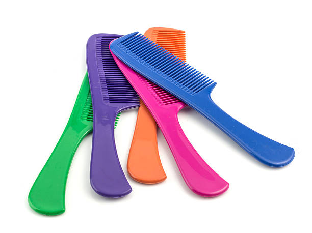 istock Colorful plastic comb isolated on white 506037724