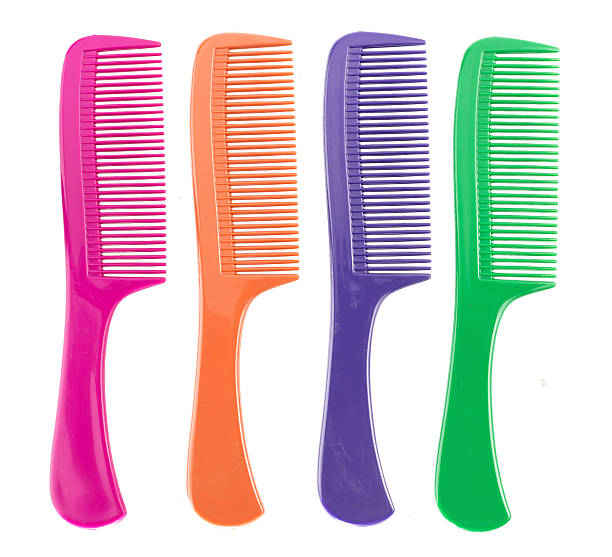 istock Top view - Colorful plastic comb isolated on white 506038318