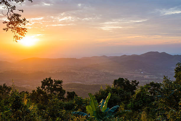 istock Light of sunset with mountains background in thailand 506040644