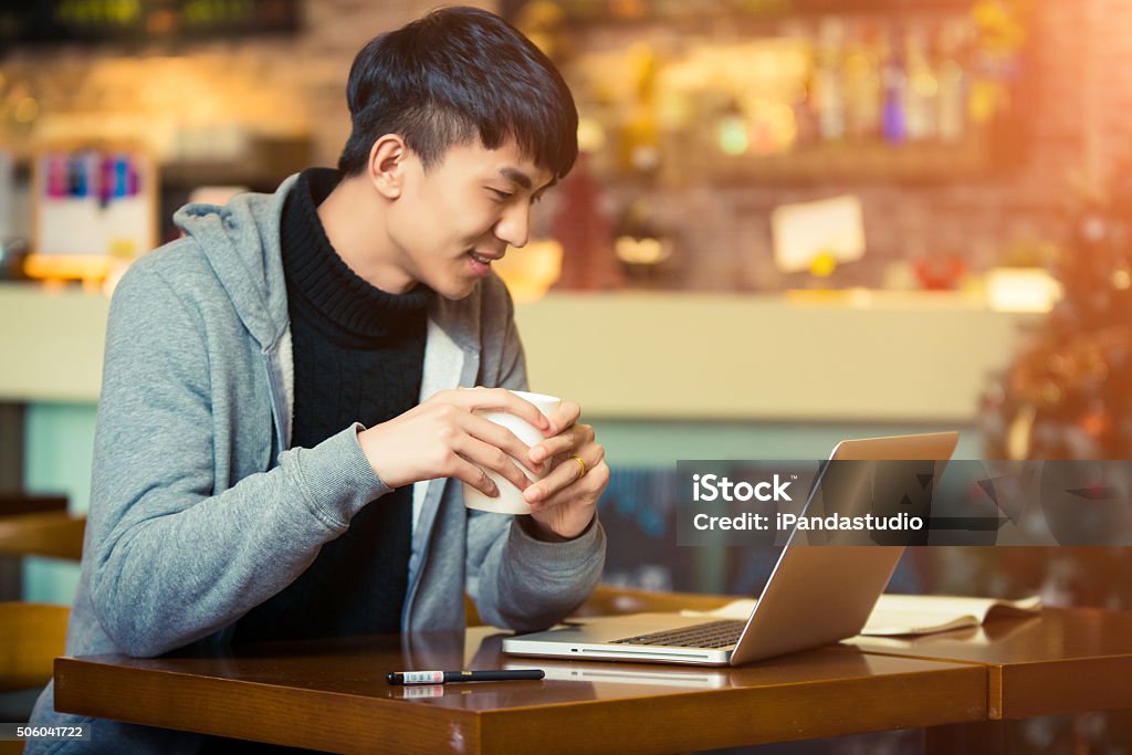 young man in a coffee house A young man in a coffee house Asia Stock Photo