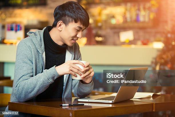 Young Man In A Coffee House Stock Photo - Download Image Now - Asia, Asian and Indian Ethnicities, East Asian Culture