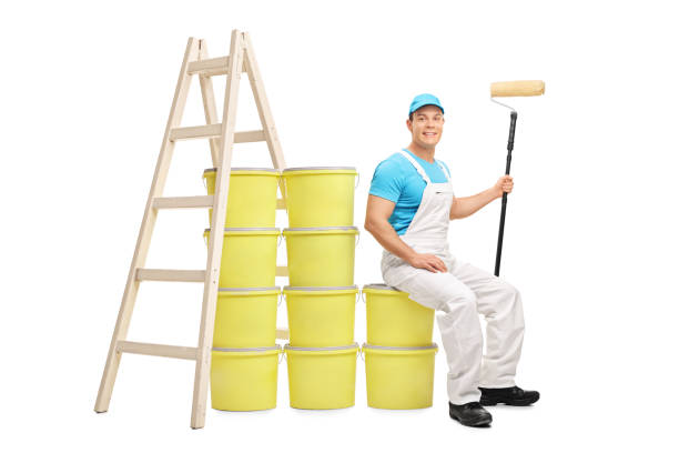 istock Decorator sitting on a pile of color buckets 506060848