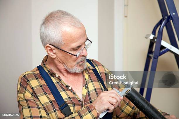 Engineer Measures With Tool The Size Of The Pipe Stock Photo - Download Image Now - Adult, Architect, Caliper