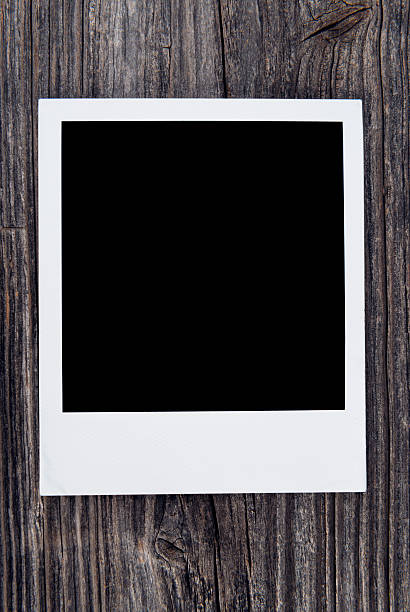 istock polaroid on a wooden background 506062529