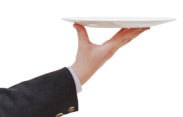 istock side view of hand with empty flat white plate 506063319