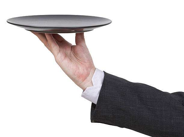 istock side view of hand with empty flat black plate 506063325
