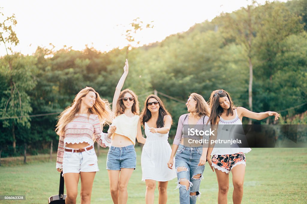 Happy female friends having fun outside in nature Womens enjoy in beautiful countryside nature Friendship Stock Photo