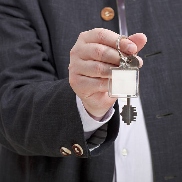 istock front view of male hand with blank door keychain 506063337