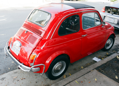 San Francisco, California, United States - February 11, 2014: Beautifully restored classic red 1960's Fiat cinquecento parked in San Francisco's Mission District.