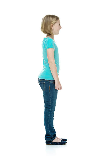 istock Smiling girl standing & looking away 506064109