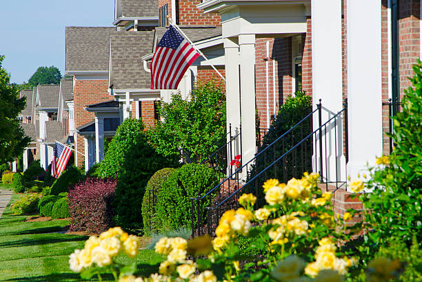istock Row of Homes with American Flags 506064147
