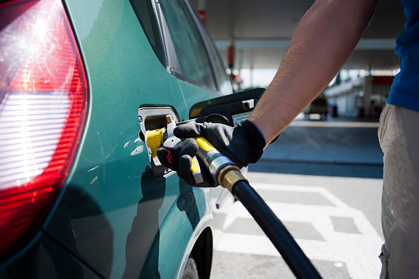 fuel pump Close up of man hands  refueling his car with LPG gas at a station liquefied petroleum gas photos stock pictures, royalty-free photos & images