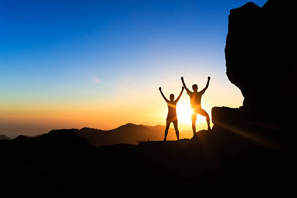 istock Couple teamwork people, inspiring success in mountains 506064480
