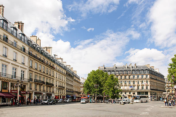 Avenue de l'Opera and Rue Saint Honore Paris, France - August 18, 2014:  Avenue de l'Opera and Rue Saint Honore in the center of Paris with cars and pedestrians on a sunny summer day place de lopera stock pictures, royalty-free photos & images