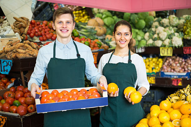 istock Supermarket workers selling fruits 506065288