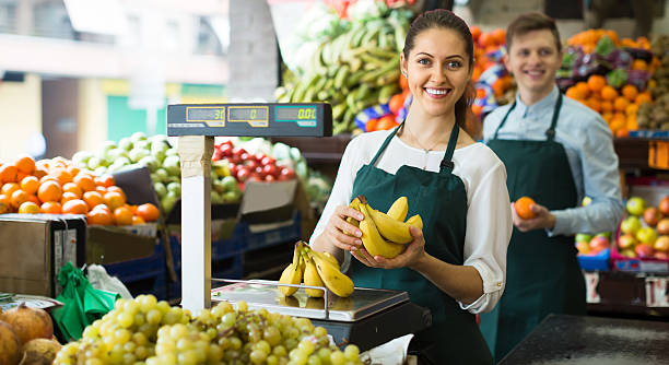 istock Sellers with bananas at market 506065410