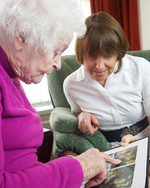 istock Care worker nurse visiting and caring for an elderly client 506067926