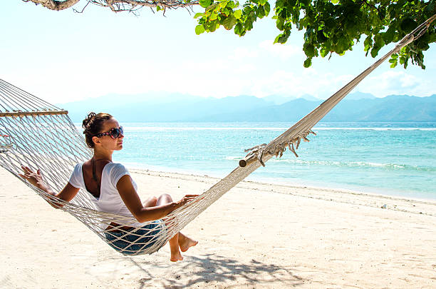 ragazza rilassante in amaca-immagine stock - hammock beach vacations tropical climate foto e immagini stock