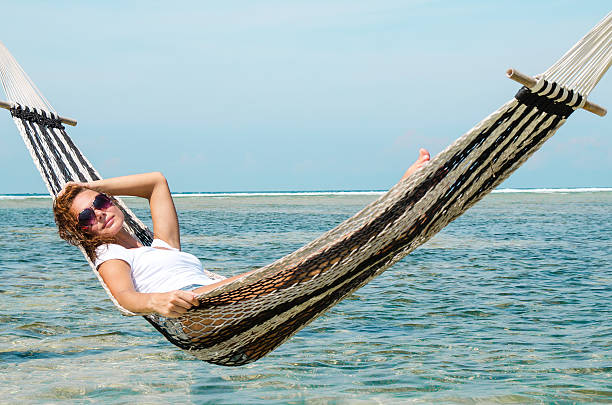 istock Girl Relaxing In Hammock - Stock image 506069928
